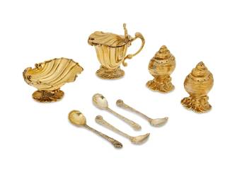 400
A group of English sterling silver gilt shell-form condiment set
1971-1972
Each marked for sterling, for London, and dated marked; marked for maker CJ Vander
Comprising an open salt cellar, a footed mustard pot with hinged lid, salt and pepper shakers, and four spoons
8 pieces
Mustard pot: 4.25" H x 4.25" W x 2.5" D; Each spoon: 4.25" L; Each shaker: 3.25" H
Total weight: 37.5 oz. troy approximately
Estimate: $1,000 - $1,500