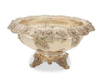 13
A Tiffany & Co. sterling silver 'Chrysanthemum' punch bowl
Late 19th/early 20th century; Directorship of Charles L. Tiffany (1891-1902)
Marked to underside: Tiffany & Co. / Makers / Sterling Silver / 925-1000 / T; numbered: 12331 / 9322
The lobed bowl with inverted rim and floral motifs throughout, raised on a four-footed base
9" H x 17.5" Dia.
119.3 oz. troy approximately
Estimate: $10,000 - $15,000