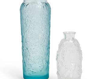 159
Two Lalique glass vases
Late 20th century
Each etched: Lalique ® France [post-1978]
Comprising a pale blue frosted glass 'Bougainvillea' vase (6.875" H x 2.5" Dia.) and a clear and frosted glass 'Femme Fleurs' bud vase (4.5" H x 2.25" Dia.)
2 pieces
Estimate: $250 - $350