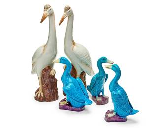 338
A group of Chinese Export ceramic models of birds
Late 20th century
Each turquoise variously marked to underside; one impressed: China
Comprising three turquoise glazed ducks and a pair of cranes depicted perched on brown tree stumps
5 pieces
Each duck: 12" H; Each crane: 22.5" H
Estimate: $300 - $500