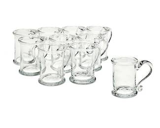 124
A set of ten Simon Pearce glass beer mugs
Late 20th/early 21st century
Etched above signature pontil mark: Simon Pearce
Each with folded rim and foot and applied handle
10 pieces
Each: 5" H
Estimate: $300 - $500