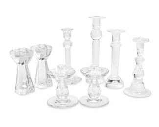 131
A group of Contemporary glass candlesticks
Late 20th/early 21st century
Baccarat with stencil mark; one VSL with script mark, the other with stencil mark: Val St. Lambert / © / M; each Steuben with etched script mark
Comprising a pair of Val Saint Lambert candlesticks with teardrops encased in the stems (6" H x 4.5" Dia.), a single Val Saint Lambert candlestick (9.5" H x 4.5" Dia.), a pair of Baccarat candlesticks of quatrefoil form (6.75" H x 3" Dia.), a Steuben candlestick with an encased teardrop and a wide flared foot (8.75" H x 4.375" Dia.), and two similar Steuben glass candlesticks, each with encased bubbles (11.5" H x 3.375" Dia.)
8 pieces
Estimate: $400 - $600