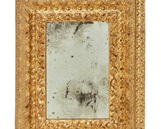 340
An Italian giltwood and gesso mirror
18th/19th century
The frame re-gilt with thick deeply carved borders
Overall: 30.5" H x 24.5" W x 4.5" D
Estimate: $500 - $700