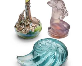 88
Three Contemporary colored glass table items
Late 20th/early 21st century
Two etched: Lalique ® France [post-1978]; one with partial factory paper label number 1183
Comprising a Lalique lavender glass nude maiden 'Floreal' figure (3.125" H x 1.75" Dia.), a Lalique blue-green glass nautilus-form paperweight (1.5" H x 3.5" W x 3" D), and a silver plate-mounted olive green blown glass bud vase (4.25" H x 2.25" Dia.)
3 pieces
Estimate: $100 - $200