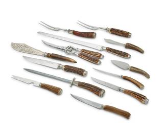 176
A group of silver plate-mounted antler-handled steak knives and serving utensils
20th century
Most variously marked for maker
Comprising a set of 6 Scully & Scully steak knives, a set of 10 George Butler & Co. steak knives, a set of 12 Rehwappen steak knives, a group of 16 carving utensils, including forks, knives, sharpening rods, and shears, and a group of 9 serving utensils primarily for cheese, together with a sterling silver-mounted antler-handled cake knife and an antler-handled corkscrew
55 pieces
Estimate: $1,000 - $1,500