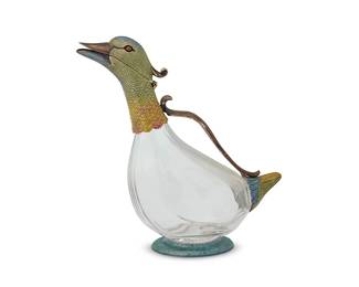 171
An Italian sterling silver-mounted glass duck-form decanter
20th century
Marked: 925
The silver components with polychrome painted hues
10.5" H x 4.5" W x 10" D
Estimate: $1,200 - $1,800