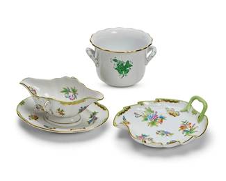 42
Three Herend porcelain service items
20th century
Each marked: Herend / Hungary / Handpainted; with blue printed factory marks above shape and pattern code
Comprising a 'Chinese Bouquet' cachepot, shape 7303 (4.5" H x 7" W x 6" D), a 'Queen Victoria' sauce boat with fixed stand, shape 234 (4" H x 9.5" W x 7" D), and a 'Queen Victoria' leaf-form dish, shape 200 (9.25" W x 8" D)
3 pieces
Estimate: $400 - $600