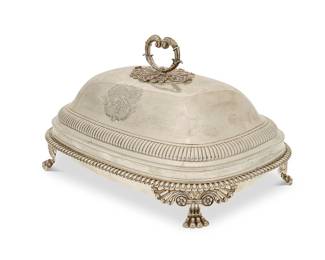 399
A Regency sterling silver lidded entrée dish
1811
Marked for sterling, for London, and date marked; maker's mark for Benjamin and James Smith
Of rectangular form, the dish raised on four scroll-headed paw supports at the rounded corners, the stepped domed lid with fluted band, with armorials on lid sides and crests on dish interior sides
7" H x 12.5" W x 9" D
64.9 oz. troy approximately
Estimate: $1,200 - $1,800
