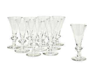 113
A set of ten Steuben glass flared and footed goblets
Late 20th century
Each etched: Steuben
Each with small teardrops to the bottom of the stems
10 pieces
Each: 7" H
Estimate: $400 - $600