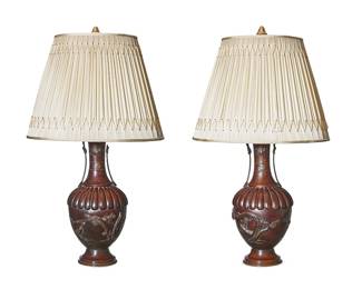 316
A pair of Japanese bronze lamps
Late 19th/early 20th century with later elements
Each converted vase decorated with bows, bats, birds, and branches, mounted as a two-light table lamp with associated pinecone gilt finials, surmounted by a pleated fabric shade, electrified
2 pieces
Each vase: 18.25" H x 7.5" Dia.; Lamp overall: 27.5" H; Each shade: 13" H x 17" W x 14.5" D
Estimate: $400 - $600