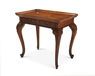 331
A Louis XV-style walnut table
20th century
The tray top with an inlaid eight-pointed star, over an apron fitted with two drawers, on cabriole legs ending in scrolled feet, each drawer interior with later moiré lining
33" H x 36.5" W x 24.75" D
Estimate: $400 - $600