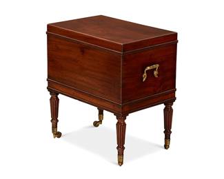 116
An Irish George IV mahogany cellarette
Early 19th century; Dublin
Stamped: GILLINGTONS; numbered: 6089
With a fitted interior, flanked by carrying handles and raised on turned reeded legs and brass cappings and casters
23" H x 23" W x 14.5" D
Estimate: $700 - $900