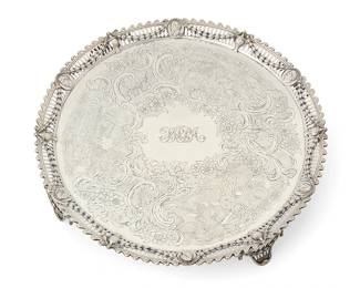 386
A George III sterling silver round footed tray
1770
Marked for sterling, for London, and date marked; maker's mark of John Carter
The pierced gallery rim with classical masks and urns joined by bellflower swags; the center with chased hunt scenes, rocaille, and floral decoration, personalized
2" H x 14.5" Dia.
47.7 oz. troy approximately
Estimate: $2,000 - $3,000