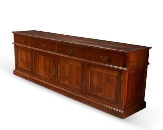 91
A large George III Provincial-style walnut sideboard
20th century
With four drawers with brass pulls above four cupboard doors, each revealing a continuous open cavity
34.5" H x 110" W x 22" D
Estimate: $1,200 - $1,800
