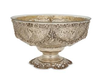 17
A German .800 silver pierced footed bowl
19th/early 20th century
With German hallmarks and marked: 800
Decorated with repoussé swags and birds, with a glass liner
6.875" H x 11" Dia.
Weighable sterling: 31.7 oz. troy approximately
Estimate: $500 - $800