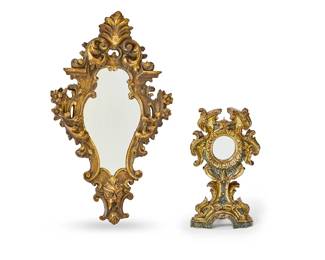 82
Two Italian Baroque-style carved giltwood mirrors
19th century
The wall mirror decorated with leaves, scrolls, florets, and a mask; the table mirror a Baroque-style monstrance now fitted with a mirror, with faux marble accents
2 pieces
Wall: 33" H x 19.5" W; Table: 19" H x 10.5" W x 8" D
Estimate: $300 - $500