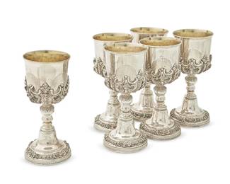 165
A set of eighteen Baroque-style silver-plated large goblets
20th century
Each unmarked
With gilt interiors and applied cast shell and scroll decoration
18 pieces
Each: 9" H x 4" Dia.
Estimate: $200 - $300