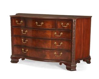342
A Baker Furniture George III-style mahogany chest of drawers
Late 20th/early 21st century
With metal tag to drawer interior: Baker Furniture
Possibly from the Stately Homes Collection, the serpentine case fitted with three small and three long drawers, each with brass pull and locking mechanism, flanked by carved foliate relief stiles, raised on ogee bracket feet
33.75" H x 57" W x 24" D
Estimate: $300 - $500