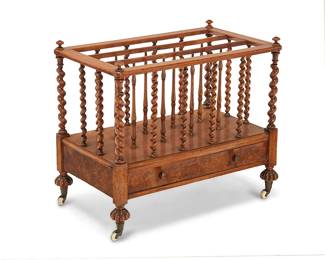 213
An English walnut canterbury
19th century
With barley twist and turned standards above a single drawer, raised on lobed feet with casters
24" H x 28.5" W x 16.5" D
Estimate: $500 - $700