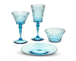 53
A Steuben wheel-engraved celeste blue glassware service
Circa 1930
Some pieces with etched factory mark
Each piece engraved with fruit and floral sprays on a pale blue ground, the knot baluster stem decorated with applied prunts, comprising twenty-six 6.875" dessert plates, twenty-three bowls (2.25" H x 4.5" Dia.), twenty-seven 6.5" white wine glasses, and twenty-one 7.875" red wine glasses
97 pieces
Estimate: $1,500 - $2,000