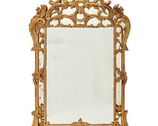 298
A Continental carved giltwood wall mirror
19th century
The frame with open scroll and foliate motifs filled in with mirror panels
67" H x 38" W x 3.25" D
Estimate: $1,200 - $1,800
