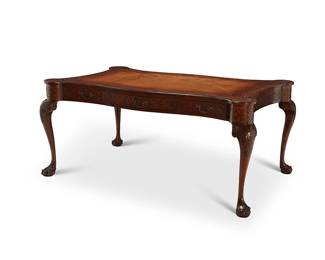 234
A George II-style mahogany partners' desk
19th century
The top inset with a brown leather writing surface above a fretwork carved apron fitted with three drawers to either side, the interiors with later moiré lining, and a pull-out writing surface on each end, raised on cabriole legs with acanthus carved knees ending in ball and claw feet
30" H x 66.5" W x 42.5" D
Estimate: $1,500 - $2,000