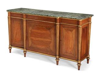 78
A Regency parcel-gilt rosewood and satinwood cabinet
Early 19th century, in the manner of Henry Holland
Of breakfront outline, surmounted by a later green marble top, enclosed by three inlaid paneled doors with oval satinwood panels, the middle door opening to a single shelf, all between projecting reeded tapered columns, on turned tapered spool feet
33" H x 60" W x 18" D
Estimate: $1,500 - $2,000