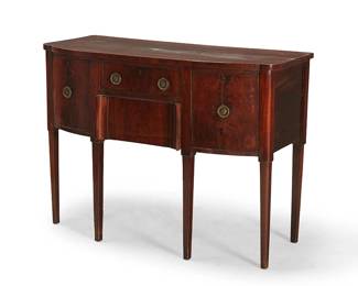 238
A George III mahogany sideboard
Late 18th century
Fitted with two locking drawers centering opposed locking cabinet doors, each with brass pulls, raised on square tapered legs
36.25" H x 48.25" W x 22" D
Estimate: $300 - $500