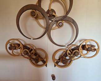 David C . Roy "Aperture" Kinetic Sculpture. Wood that Works. This link will demonstrate its motion on the wall. http://woodthatworks.squarespace.com/blog/2013/2/16/aperture-from-1993-a-video-at-last.html