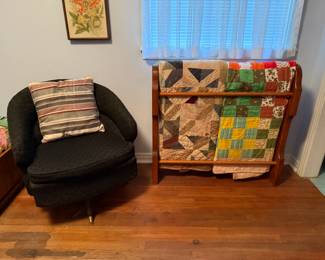 BLACK SWIVEL CHAIR AND HAND MADE QUILTS