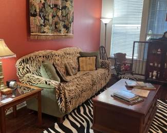 Living room furniture. Couch not in good condition. Coffee table, antique rocking chair, antique chair, area rug, side table in good condition