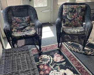 Wicker rocker chairs. Coffee table. rug