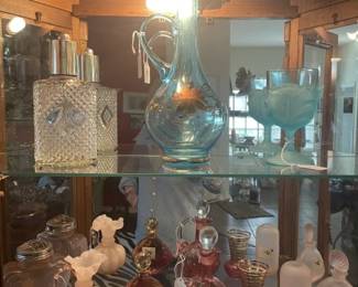 Pretty 'aqua' colored glass on top shelf w/ decanter