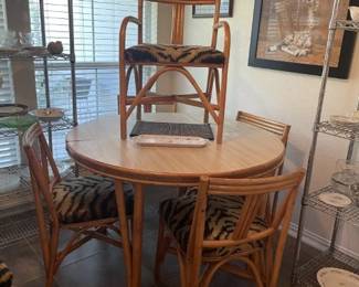 Dining table w/ 6 chairs (one not shown), 2 arm chairs. One leaf.