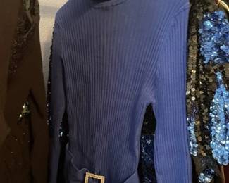 Sweater has a rhinestone buckle