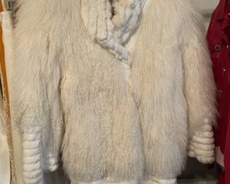 Pia Rucci Lamb and Rabbit Fur Coat. Beautiful. Has a stain in the lining . Needs to be professionally cleaned.