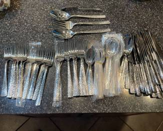 Service for 12 flatware set. Looks new although a few pieces have been used.