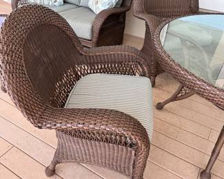 #2 - $600 - All weather wicker brown table 52"Dx31T & 4 armchairs 32x28x38 - nesting under table - very good condition 