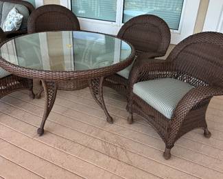 #2 - $600 - All weather wicker brown table 52"Dx31T & 4 armchairs 32x28x38 - nesting under table - very good condition 