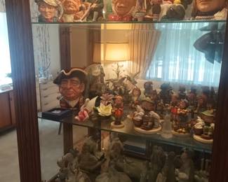 Royal Doulton mugs and other items in curio