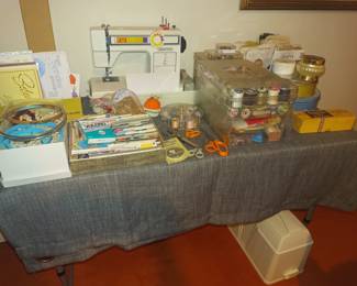 White sewing machine (yes, that's the brand) and sewing goodies