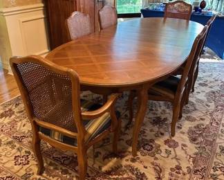 Thomasville antique walnut dining table, 64"x45" includes 3 leaves 12" wide. Matching chairs, 1 captain and 5 dining.