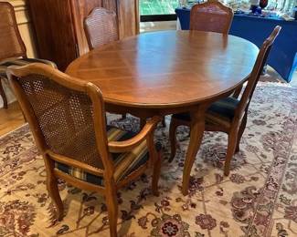 Thomasville antique walnut dining table, 64"x45" includes 3 leaves 12" wide. Matching chairs, 1 captain and 5 dining.