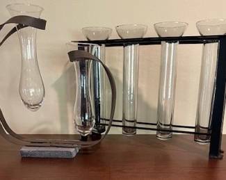Flower glass vases with metal displays.