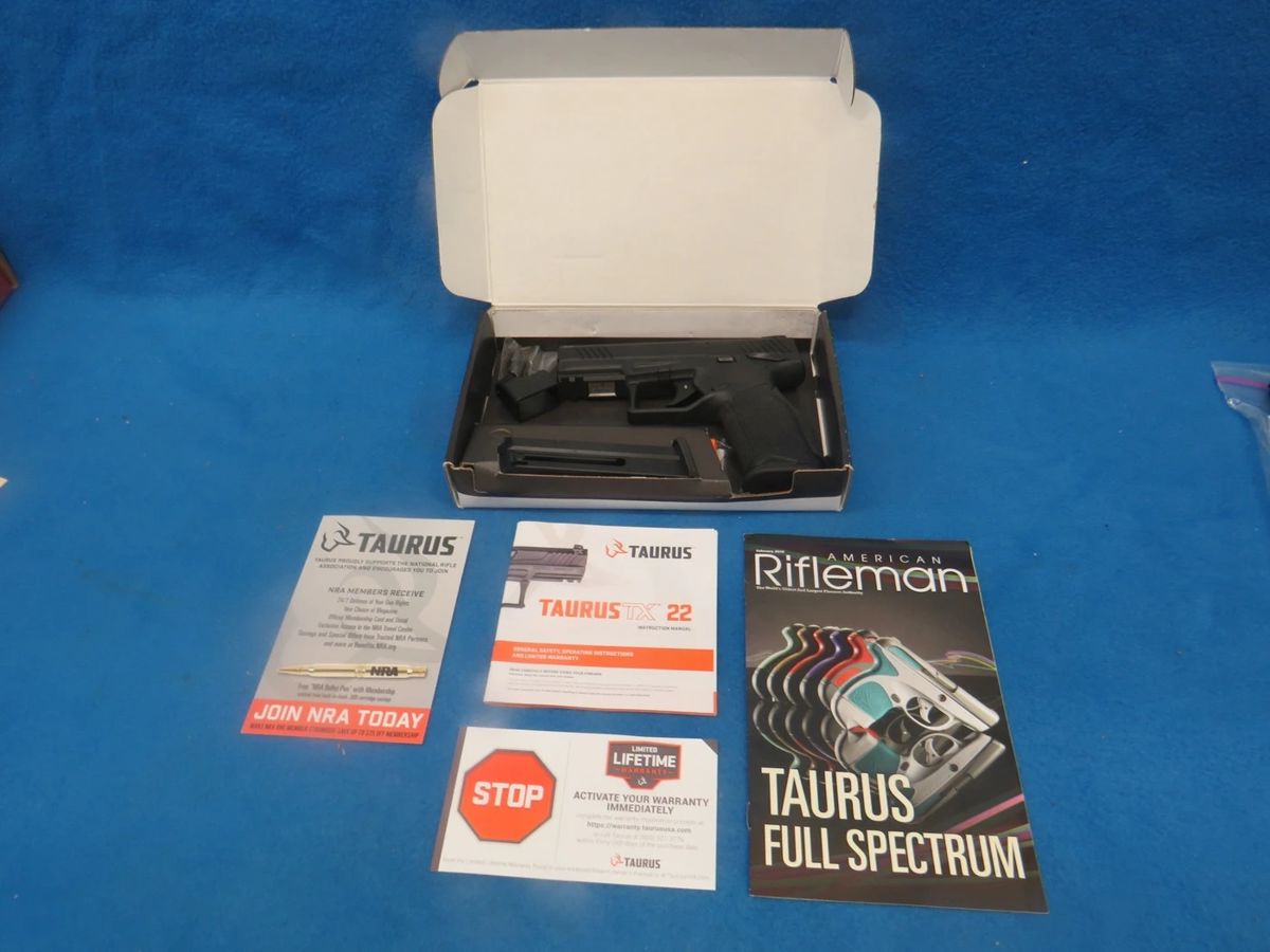 Lot 9. Taurus TX22 .22LR semi-auto pistol. SN 1PT329299. Includes one magazine, manual, and original box.