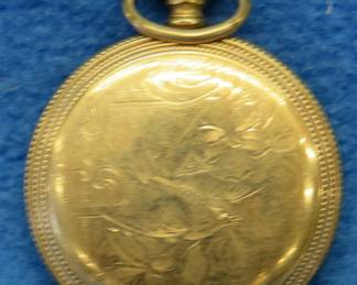Lot 17. Working gold watch with Illinois Watch Co. marks. 17-jewel movement. Movement cover marked Admiral 14K. Keeps time but time-setting feature is inoperable.
