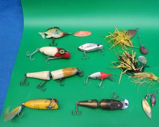 Lot 34. Bag O' Baits: Lucky 13.South Bend wooden Babe-Oreno.CCBC jointed wooden Pikie with glass eyes.CCBC jointed plastic Pikie.And more