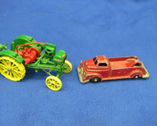 Lot 149. Small-scale die-cast John Deere Waterloo Boy tractor and an old metal tow truck