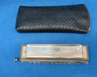 Lot 222. Wm. Kratt Super "48" chromatic harmonica with a soft case.