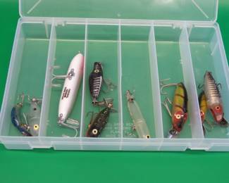 Lot 31. Nine Heddon baits: 4 River Runts, a Zara Spook, and a Zara puppy. 2 Tiny Torpedoes, and a Clatter Tad.